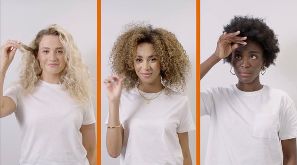 Three women with wavy, curly and coily hair on a white background