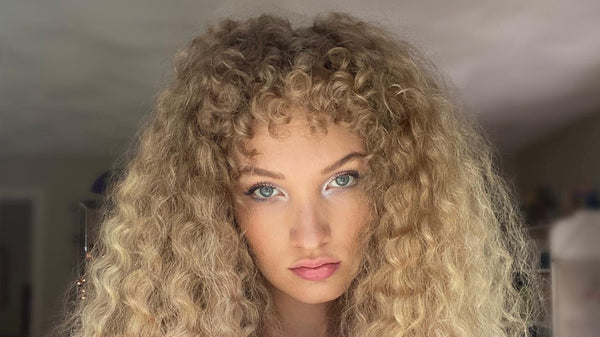 Woman with blonde curly hair