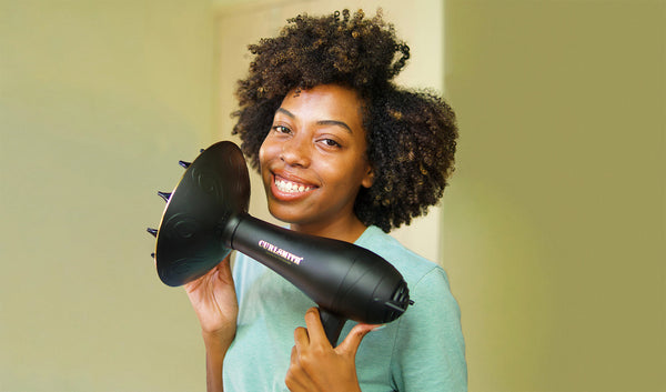 Woman holding a hair dryer