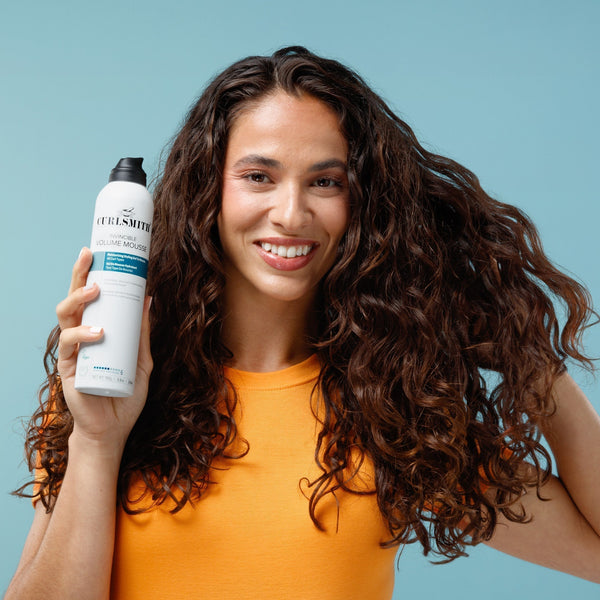 Woman holding Curlsmith spray