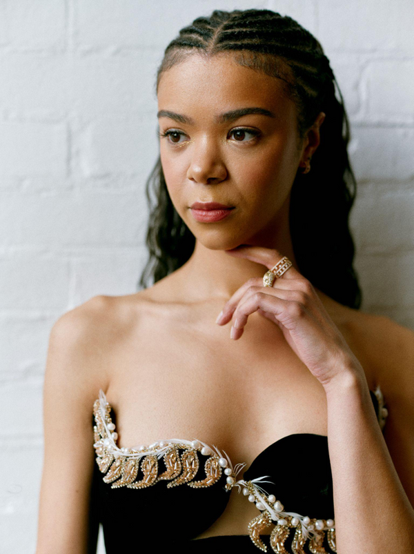Woman showcasing a proactive hairstyle on a white background