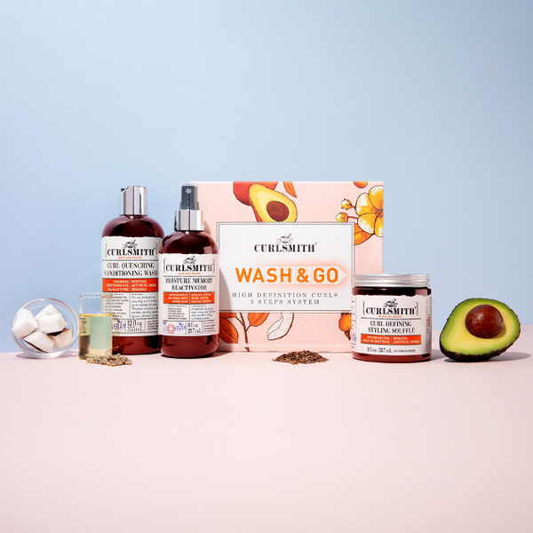Curlsmith Wash & Go box and products on a blue and pink background