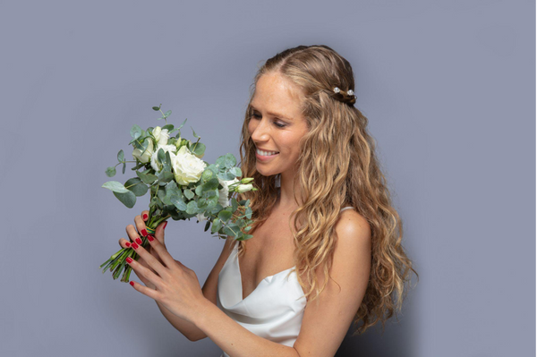 Woman with half up half down hair and flowers