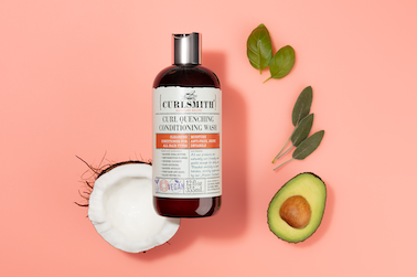 Curl Quenching Conditioning Wash with avocado and coconut a pink background