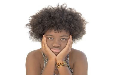 Upset woman with coily hair