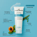 Curlsmith In-Shower Style Fixer tube with product features on a blue background