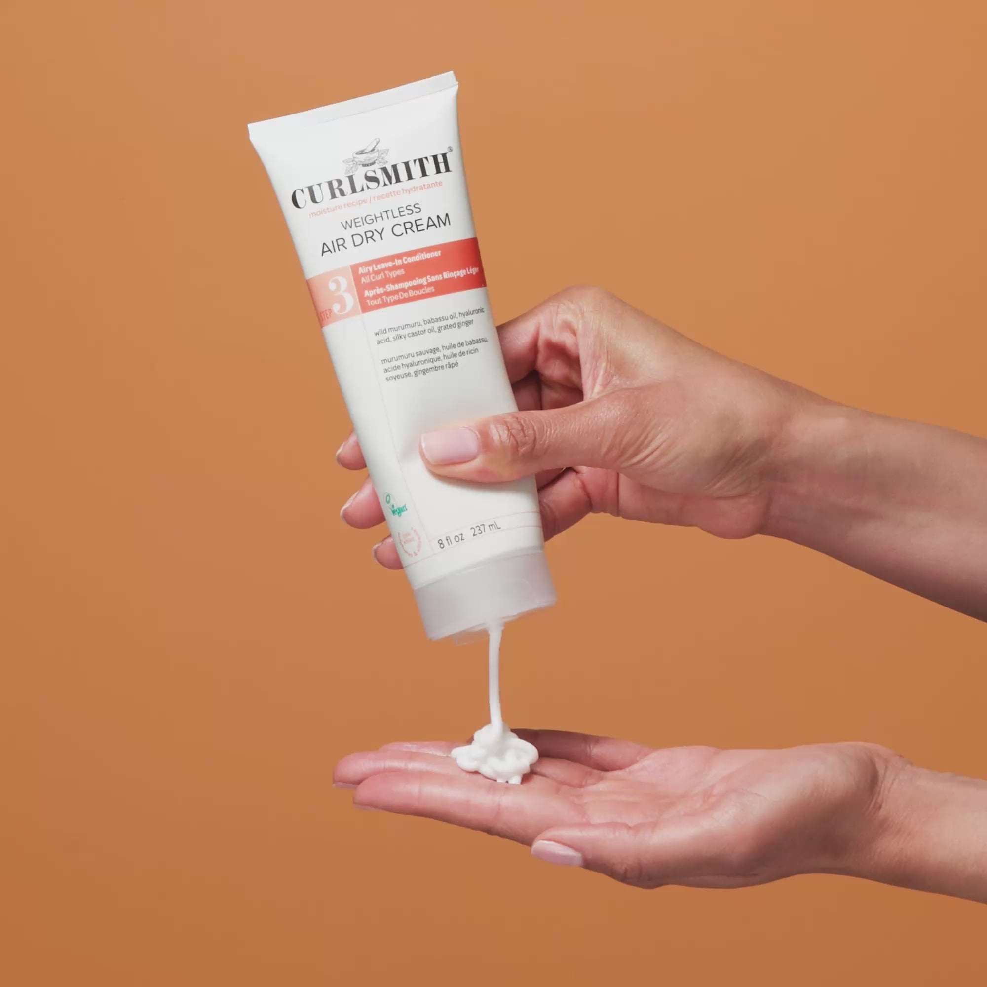 Person applying Curlsmith Weightless Air-Dry Cream