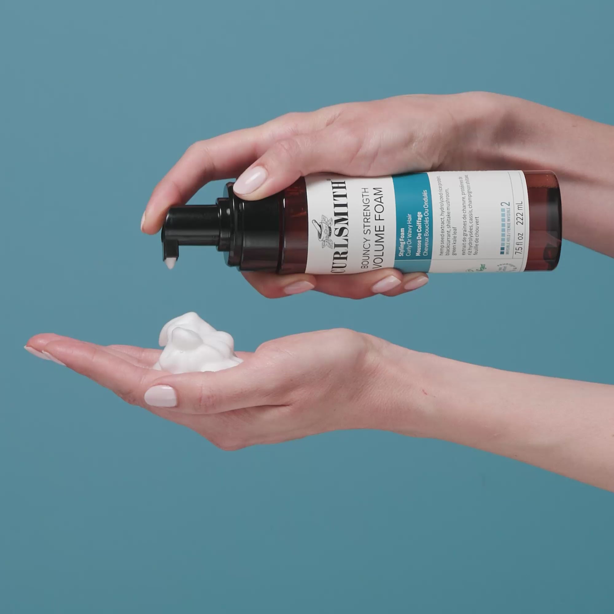 Person applying Curlsmith Boundy Strength Foam