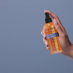 Person applying Curlmith Shake & Shine